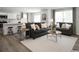 Open-concept living area featuring a kitchen, dining space, and a comfortable seating area with sofas at 1055 Oak Meadow Dr., Conway, SC 29526