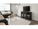 Comfortable living room with a large window, a TV console, and a cozy sofa at 1055 Oak Meadow Dr., Conway, SC 29526