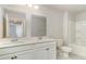 A well-lit bathroom featuring double vanity sinks, a bathtub and toilet at 748 Rupert Dr, Conway, SC 29526
