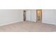 Bedroom with plush carpeting, doorway to ensuite bathroom and eat-in kitchen at 748 Rupert Dr, Conway, SC 29526
