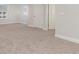 Carpeted bedroom with white trim and multiple doors to closets and other rooms at 748 Rupert Dr, Conway, SC 29526