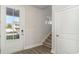 Bright entryway featuring a glass front door, wood floors, and a staircase at 748 Rupert Dr, Conway, SC 29526