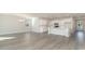 Open-concept living space featuring wood floors, modern lighting, and seamless kitchen integration at 748 Rupert Dr, Conway, SC 29526