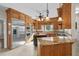 Spacious kitchen featuring custom wood cabinetry, stainless steel appliances and a large center island at 9325 Cove Dr., Myrtle Beach, SC 29572
