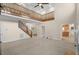 Spacious living room with soaring ceilings, a second-floor balcony, and staircase at 9325 Cove Dr., Myrtle Beach, SC 29572