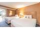 Comfortable bedroom with two beds, soft lighting, and a view of the balcony at 1501 South Ocean Blvd. # 644, Myrtle Beach, SC 29577