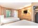Bedroom with two beds, a TV, closet, and access to an outdoor balcony at 1501 South Ocean Blvd. # 644, Myrtle Beach, SC 29577