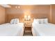 Well-appointed bedroom with two beds, bedside lamps, and a convenient nightstand at 1501 South Ocean Blvd. # 644, Myrtle Beach, SC 29577