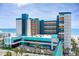 Multi-story resort featuring a vibrant teal and orange color scheme, located near the beach at 1501 South Ocean Blvd. # 644, Myrtle Beach, SC 29577