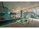 Indoor pool with unique water features, lounge chairs, and accessible stair entry at 1501 South Ocean Blvd. # 644, Myrtle Beach, SC 29577