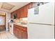 Full kitchen with microwave, range, sink, cabinets, and white refrigerator at 1501 South Ocean Blvd. # 644, Myrtle Beach, SC 29577