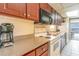 Fully-equipped kitchen featuring a microwave, oven, and ample counter space at 1501 South Ocean Blvd. # 644, Myrtle Beach, SC 29577