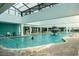 Indoor pool area beneath a glass ceiling, complete with fountain at 1501 South Ocean Blvd. # 644, Myrtle Beach, SC 29577
