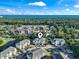 Aerial view of complex shows landscaping, pond, and parking at 1100 Commons Blvd. # 104, Myrtle Beach, SC 29572