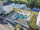 Aerial view of community pool, landscaped grounds, and waterway at 1100 Commons Blvd. # 104, Myrtle Beach, SC 29572