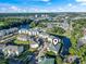 Aerial view of building and landscaping shows nearby waterway at 1100 Commons Blvd. # 104, Myrtle Beach, SC 29572