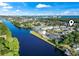 Waterway view of building showing landscaping and nearby community at 1100 Commons Blvd. # 104, Myrtle Beach, SC 29572