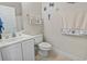 Cozy bathroom features neutral vanity and nautical decor creating a charming ambiance at 1100 Commons Blvd. # 104, Myrtle Beach, SC 29572
