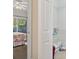 View of a bedroom with slider to porch and the door open to the walk in closet at 1100 Commons Blvd. # 104, Myrtle Beach, SC 29572