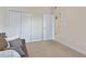 Neutral bedroom featuring double closets, a soft carpet, and an open doorway for seamless flow at 1100 Commons Blvd. # 104, Myrtle Beach, SC 29572