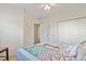 Bedroom featuring carpet, ceiling fan, walk-in closet and window for a well-lit and comfortable space at 1100 Commons Blvd. # 104, Myrtle Beach, SC 29572