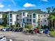 Multi-level condo building with ample parking, well-maintained landscaping, and attractive architectural details at 1100 Commons Blvd. # 104, Myrtle Beach, SC 29572