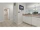 Bright kitchen area featuring a tiled floor, a dishwasher, and an opening to the living and dining area at 1100 Commons Blvd. # 104, Myrtle Beach, SC 29572