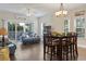 Open living area with hardwood floors, comfortable blue sofas, and access to a private balcony at 1100 Commons Blvd. # 104, Myrtle Beach, SC 29572