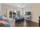 Cozy living room with hardwood floors, comfortable seating, and access to an outdoor patio for relaxed living at 1100 Commons Blvd. # 104, Myrtle Beach, SC 29572