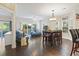 Inviting living area with hardwood floors, comfortable seating, and natural light from sliding glass doors at 1100 Commons Blvd. # 104, Myrtle Beach, SC 29572