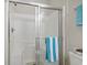 Clean and modern shower with glass doors and white tile at 1100 Commons Blvd. # 104, Myrtle Beach, SC 29572