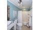 Clean bathroom with a white tub, shower, and a coastal-themed vanity at 1612 Edge Dr., North Myrtle Beach, SC 29582