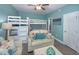 Bedroom with twin-over-full bunk bed and light beige couch at 1612 Edge Dr., North Myrtle Beach, SC 29582