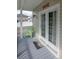 Small deck with green chair and welcome mat at 1612 Edge Dr., North Myrtle Beach, SC 29582