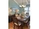Elegant dining room with a dark wood table, white chairs, and stylish decor at 1612 Edge Dr., North Myrtle Beach, SC 29582