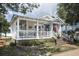 Charming house exterior with a welcoming front porch and landscaped yard at 1612 Edge Dr., North Myrtle Beach, SC 29582