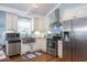 Modern kitchen with stainless steel appliances and white shaker cabinets at 1612 Edge Dr., North Myrtle Beach, SC 29582