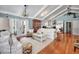 Bright living room with vaulted ceilings, hardwood floors, and comfy white sofas at 1612 Edge Dr., North Myrtle Beach, SC 29582