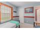 Bedroom featuring twin beds, blue walls, and decorative nautical paintings and fence window frame at 376 Mckendree Ln., Myrtle Beach, SC 29579