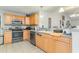 Bright kitchen featuring stainless steel appliances, modern cabinetry and tile flooring at 376 Mckendree Ln., Myrtle Beach, SC 29579