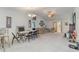 Spacious open concept living area with chairs, table and electric fireplace at 376 Mckendree Ln., Myrtle Beach, SC 29579