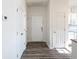 Bright entryway boasts wood-look flooring, white walls, and multiple storage closets upon entry at 2060 Cross Gate Blvd. # 305, Surfside Beach, SC 29575