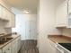 Bright and practical kitchen with white cabinets, laminate countertops, and essential appliances at 2060 Cross Gate Blvd. # 305, Surfside Beach, SC 29575