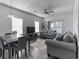 Open concept living and dining area with neutral decor and plenty of natural light throughout at 2060 Cross Gate Blvd. # 305, Surfside Beach, SC 29575