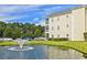 A beautiful pond with fountain and well-manicured lawns create a serene outdoor space at this property at 2060 Cross Gate Blvd. # 305, Surfside Beach, SC 29575