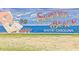 Surfside Beach sign with a mural of a lady, ocean, and flying seagulls at 2060 Cross Gate Blvd. # 305, Surfside Beach, SC 29575