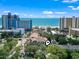 A birds-eye view shows a condo complex nestled among the trees with ocean views at 2805 N Ocean Blvd. # 214, Myrtle Beach, SC 29577