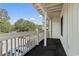 Spacious balcony with white railings and a view of the neighborhood at 2805 N Ocean Blvd. # 214, Myrtle Beach, SC 29577