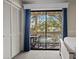 Bedroom with sliding door to a balcony overlooking a pool and seating area at 2805 N Ocean Blvd. # 214, Myrtle Beach, SC 29577