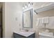 Bathroom vanity with a sink, framed mirror, and wall-mounted towel rack at 2805 N Ocean Blvd. # 214, Myrtle Beach, SC 29577